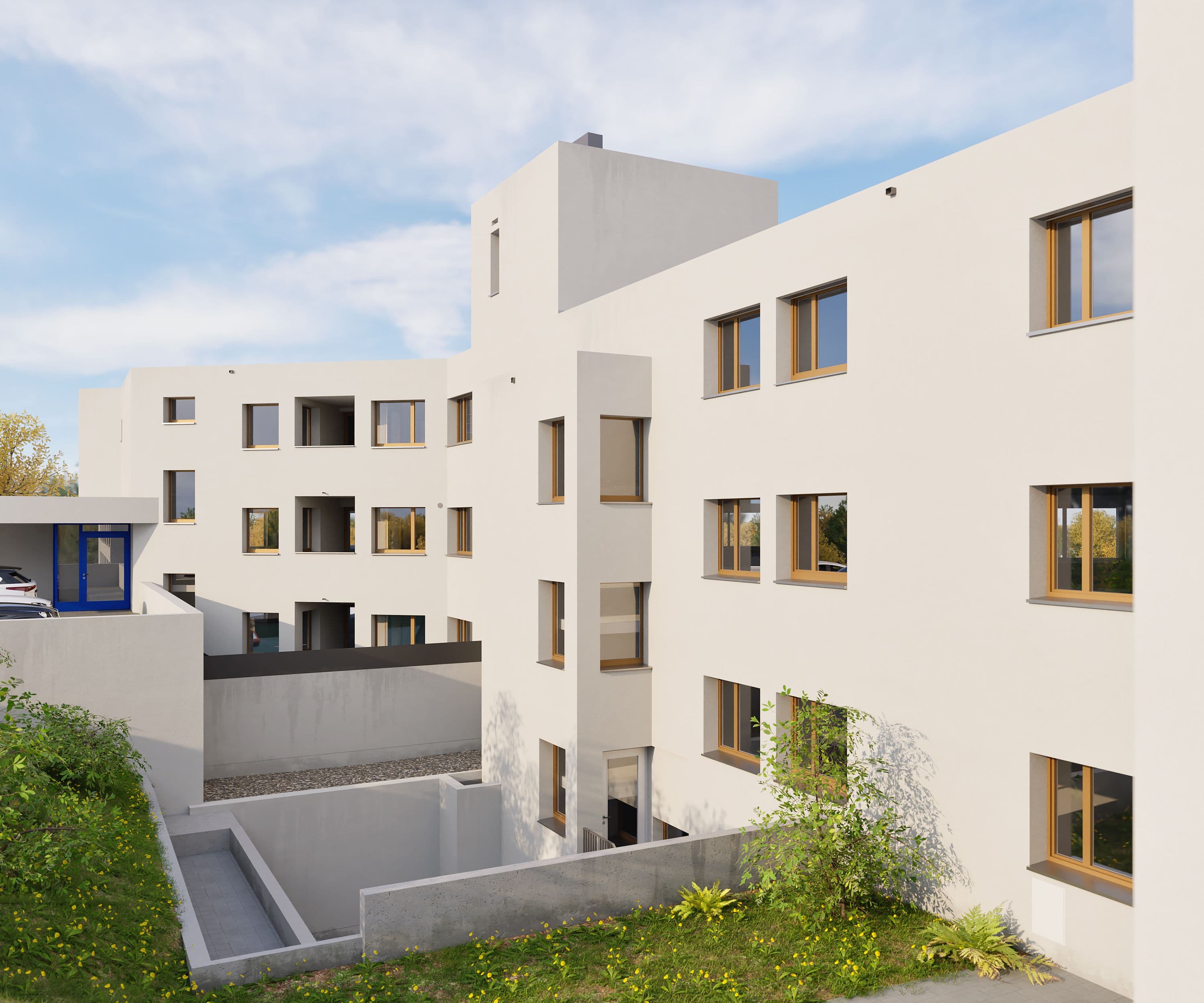 Moderne Apartmentanlage mit Balkonen unter blauem Himmel.